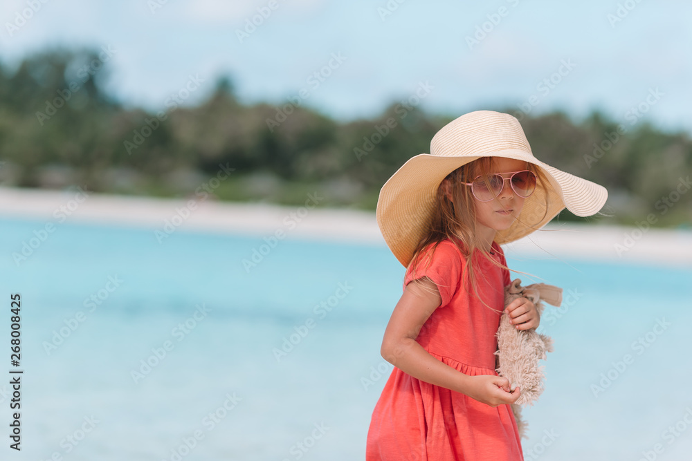 Adorable little girl at beach during summer vacation Adorable little girl at beach during summer vacation