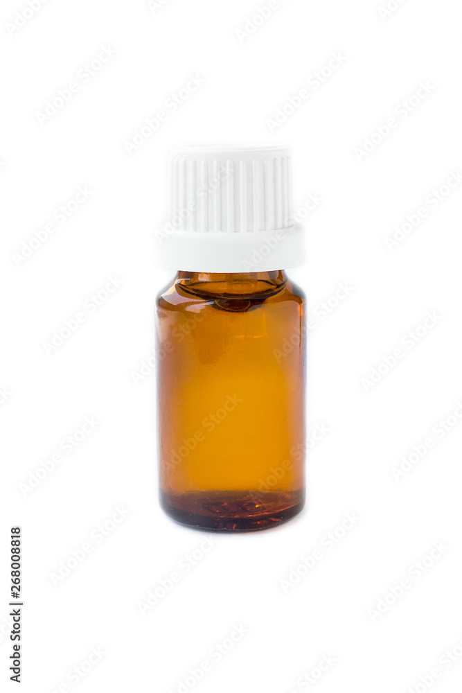 natural oil in a glass brown bottle on a white background