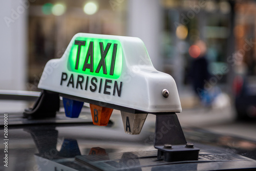 Taxi Parisien sign on a car, Paris France