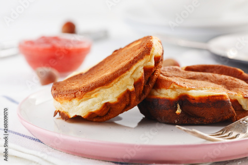 breakfast. Pancakes with peanut and strawberry jam. closeup.