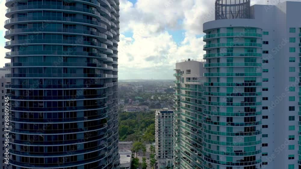 MIAMI, FLORIDA, USA - MAY 2019: Aerial drone view flight over Miami downtown. Streets, residential buildings from above. MIAMI, FLORIDA, USA - MAY 2019: Aerial drone view flight over Miami downtown. Streets, residential buildings from above.