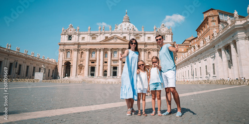 Happy family in Vatican city and St. Peter's Basilica church, Rome, Italy