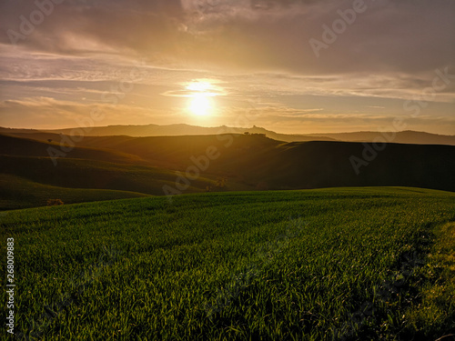 Hilly landscape at sunset. © isaac74