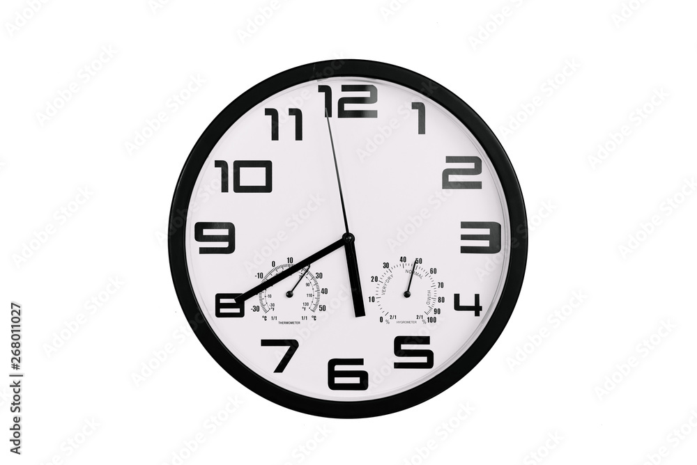 simple classic black and white round wall clock isolated on white. Clock with arabic numerals on wall shows 17:40 , 5:40 simple classic black and white round wall clock isolated on white. Clock with arabic numerals on wall shows 17:40 , 5:40