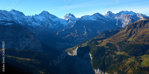 Panoramic view of the mountains at sunrise in Lauterbrunnen valley in Switzerland.