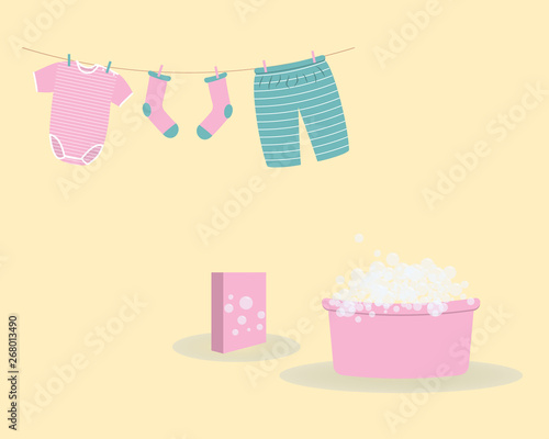 Washing: washed baby clothes cute Capri pants,socks and  bodysuit hanging on clothesline and they are attached by clothespins.Wash basin with soap foam and pack of washing powder.Vector illustration