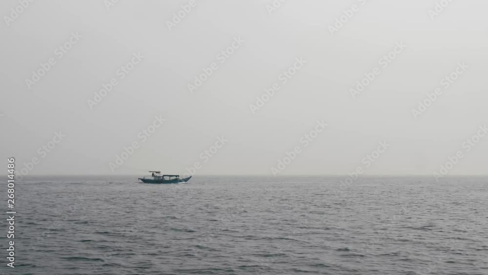 Traditional Boat Sailing On Calm Sea In Vietnam, Side View. Traditional Boat Sailing On Calm Sea In Vietnam, Side View.