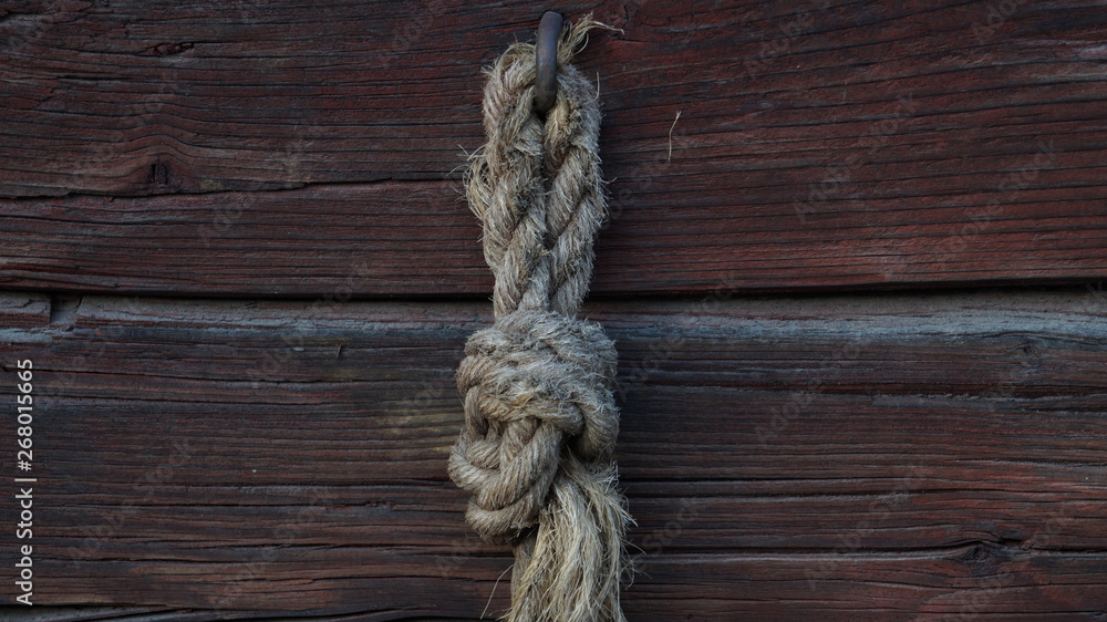 Rope on wooden background