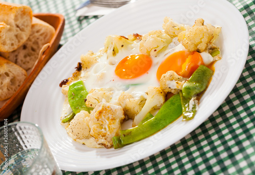 Appetizing cauliflower fried eggs for breakfast