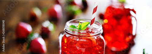 Obraz na plátně strawberry cocktail in mason jar with mint garnish panorama