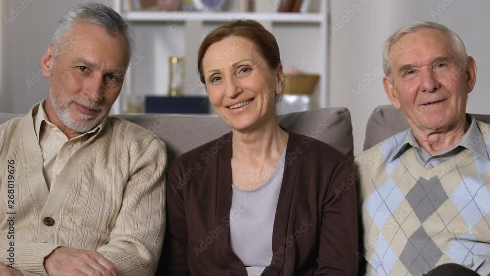 Healthy senior people smiling on camera sitting sofa, nursing home, good mood Healthy senior people smiling on camera sitting sofa, nursing home, good mood