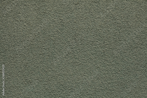 Dirty green painted stucco wall. Background texture