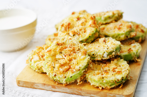 baked parmesan zucchini crisps with cream sauce