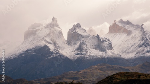 Close up of Mountain Range of Torres del Paine Chile with clouds and filter