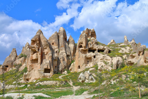 Landscape with an ancient cave settlement in the mountains of Cappadocia, in spring.