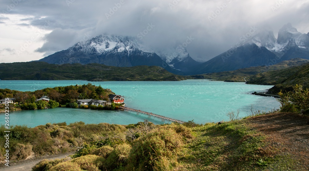Chile Patagonia Torres del Plaine.  With turquoise colored lake in front of snow covered mountain. 