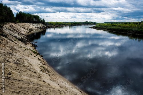 Steep sandy cliff on the Klyazma River in the Ivanovo region. photo