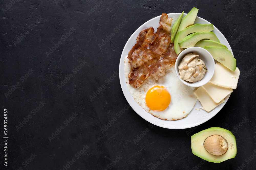 Ketogenic diet: bacon, avocado, hummus, tomato, eggs. Healthy fats. Ketogenic diet: bacon, avocado, hummus, tomato, eggs. Healthy fats.