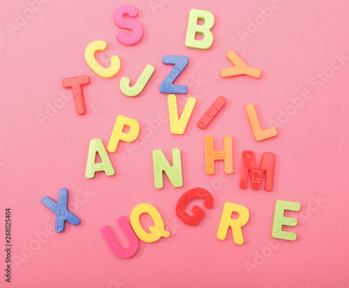 Set of colorful plastic alphabets isolated on background.