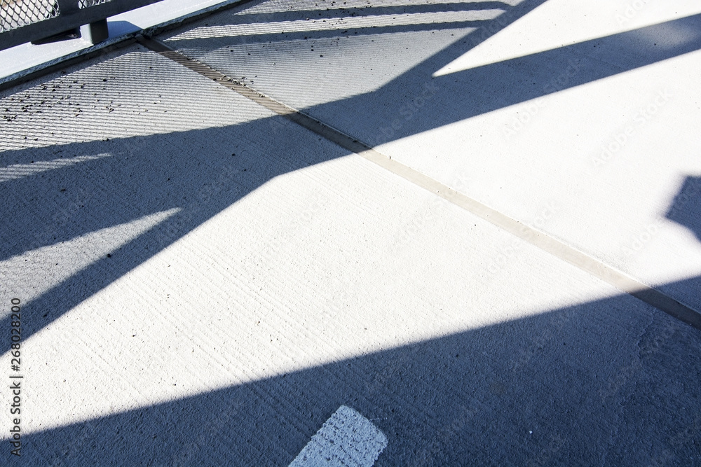 Fototapeta premium Empty asphalted street with light and dark