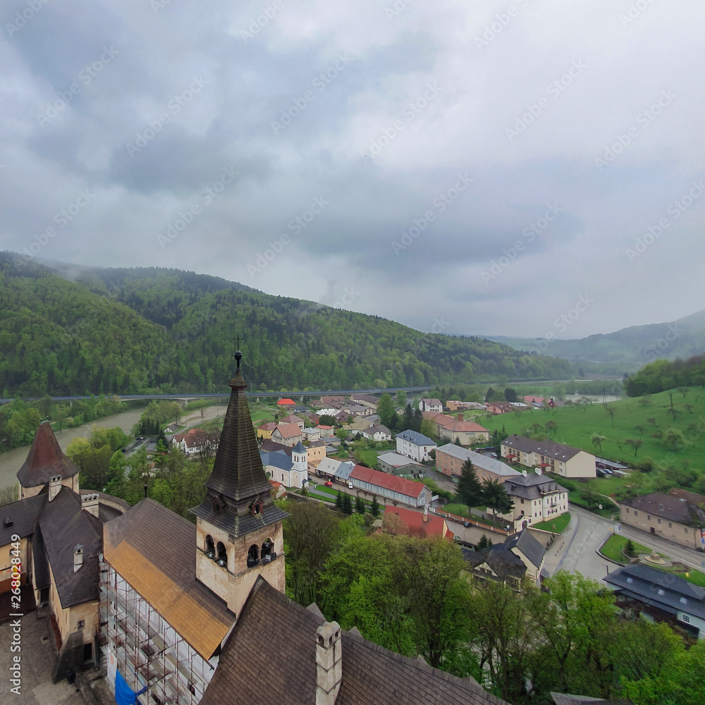 Orava Podzamok, Slovakia. May, 2019. The famous medieval castle in the Slovak Tatras on the edge of chipped. Visited tourist place. Mountain, river, village.