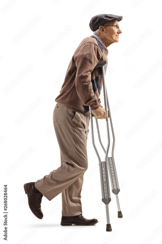 Senior man walking with crutches Senior man walking with crutches