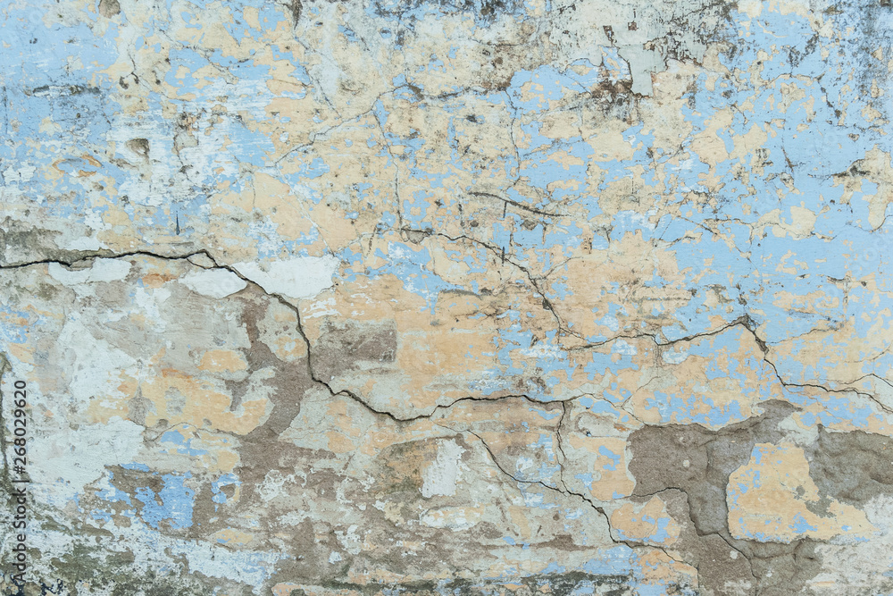 Obraz premium background of a shabby old wall painted in yellow and blue