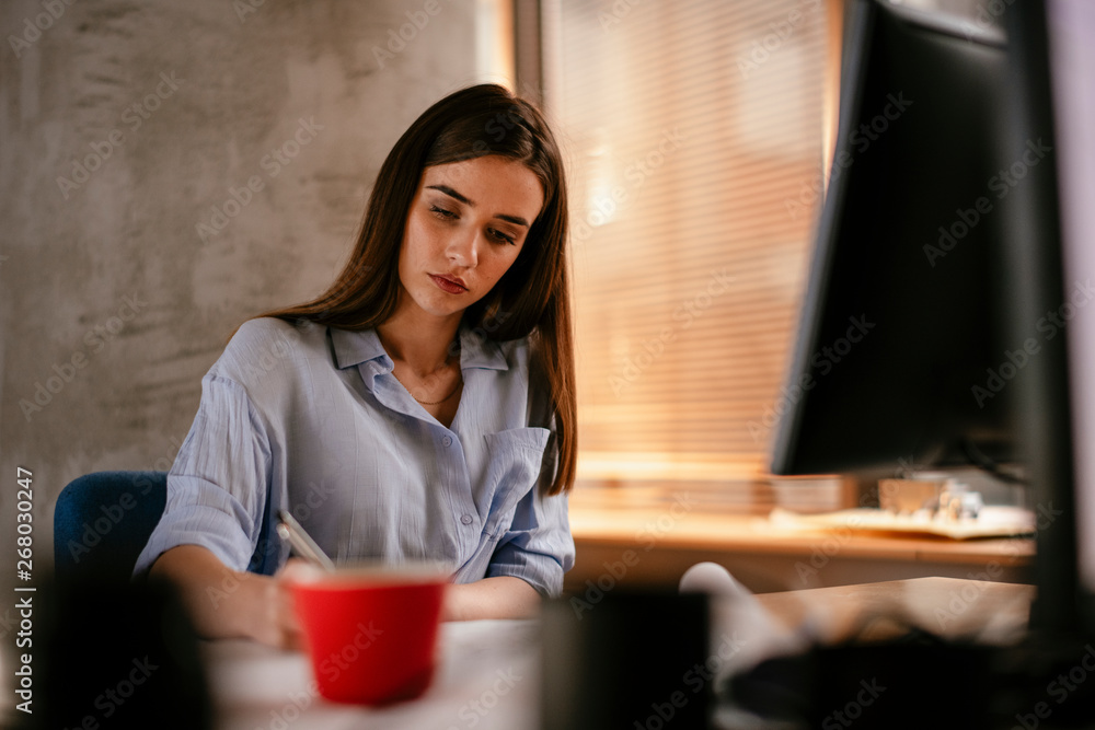Businesswoman working on project Businesswoman working on project