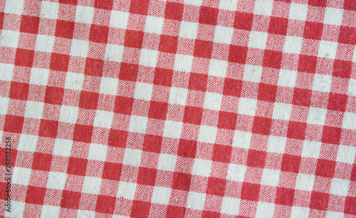 Red linen checkered tablecloth. Red and white texture.
