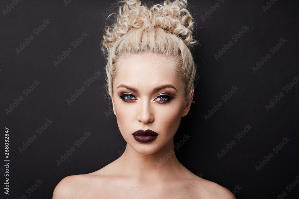 Sexy naked young woman with dark red full lips and with beautiful blue eyes  with blond curly hair and with bright makeup, isolate at black background  Stock Photo | Adobe Stock