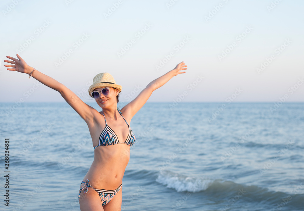 beautiful woman swim wear at the beach in sunny summer beautiful woman swim wear at the beach in sunny summer