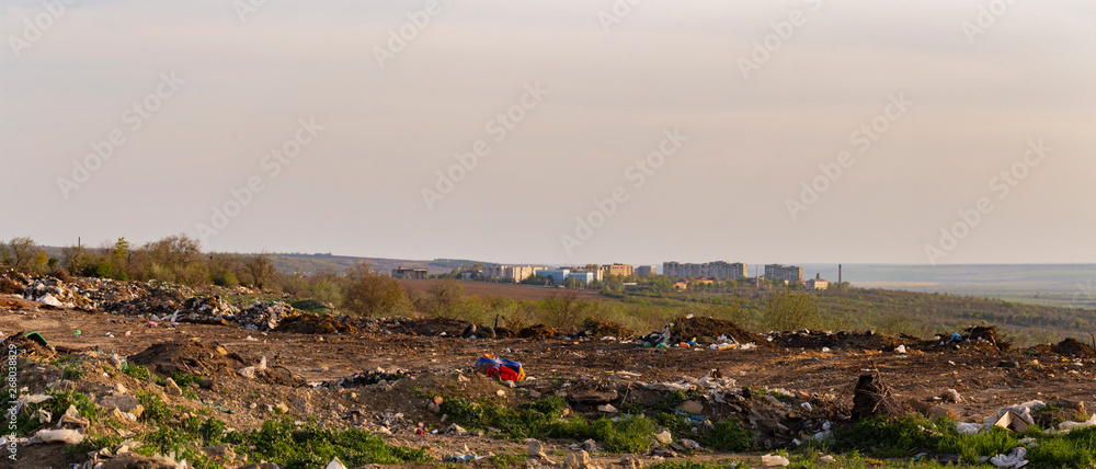 Environmental disaster. Clogging the outskirts of the city. Garbage heaps are an element of the modern European landscape.