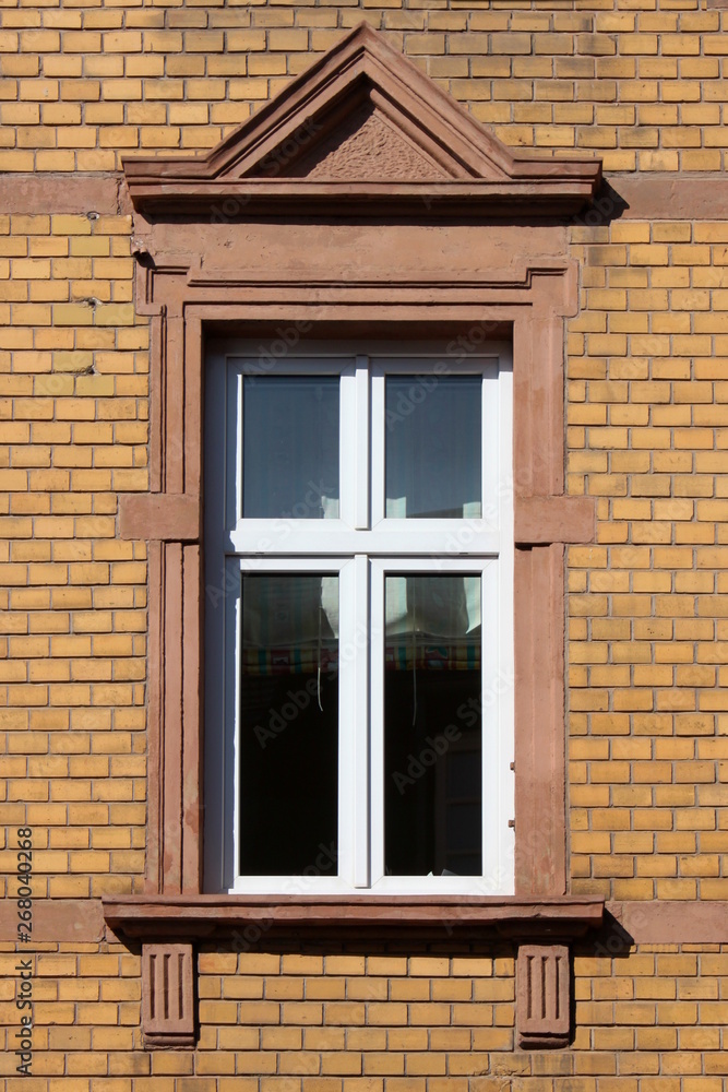 Historistic window in a yellow brick facade in Wittlich, Germany
