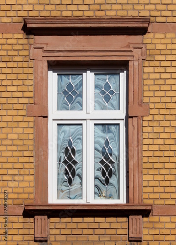 Historistic window in a yellow brick facade in Wittlich  Germany
