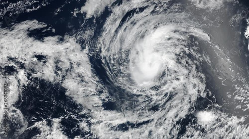 Hurricane rotating on ocean, aerial satellite view. Contains public domain image by Nasa photo