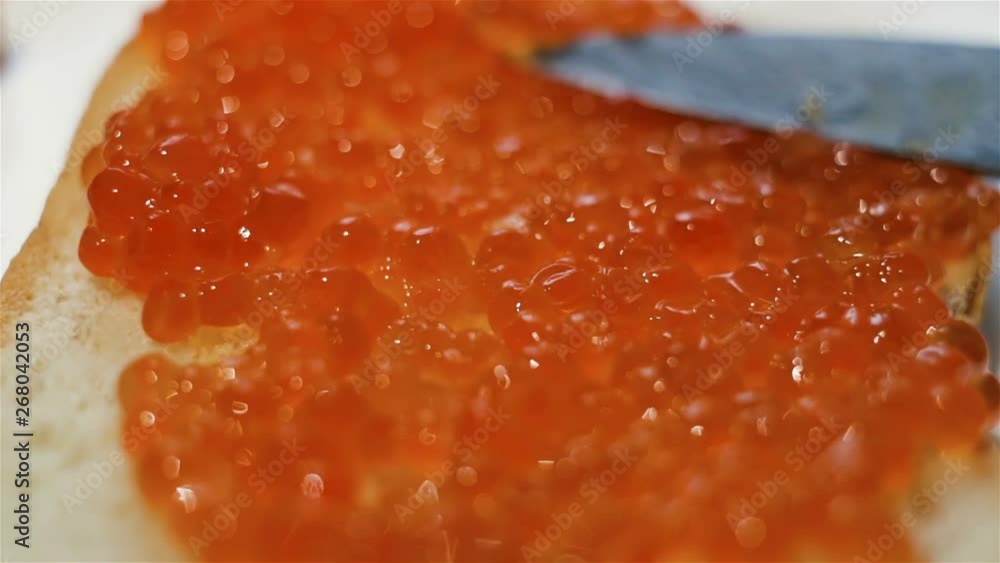Spread caviar on bread, spread caviar with a knife. Close-up, real time, Spread caviar on bread, spread caviar with a knife. Close-up, real time,