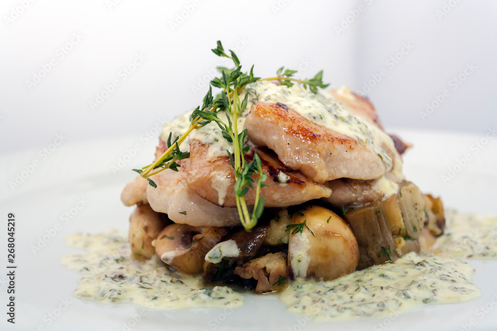 fried pork with mushrooms, potatoes, rosemary and tartar sauce on a white background isolated fried pork with mushrooms, potatoes, rosemary and tartar sauce on a white background isolated