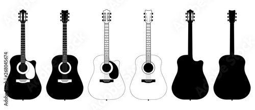 A set of acoustic classic guitars of black on white background. String musical instruments