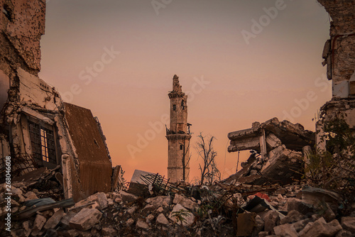 Murais de parede Destroyed buildings next to a mosque in the city of Aleppo in Syria