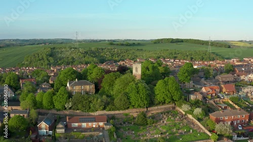 A Drone view of St Helen's Church in Treeton, South Yorkshire, UK - Spring during Sunset photo