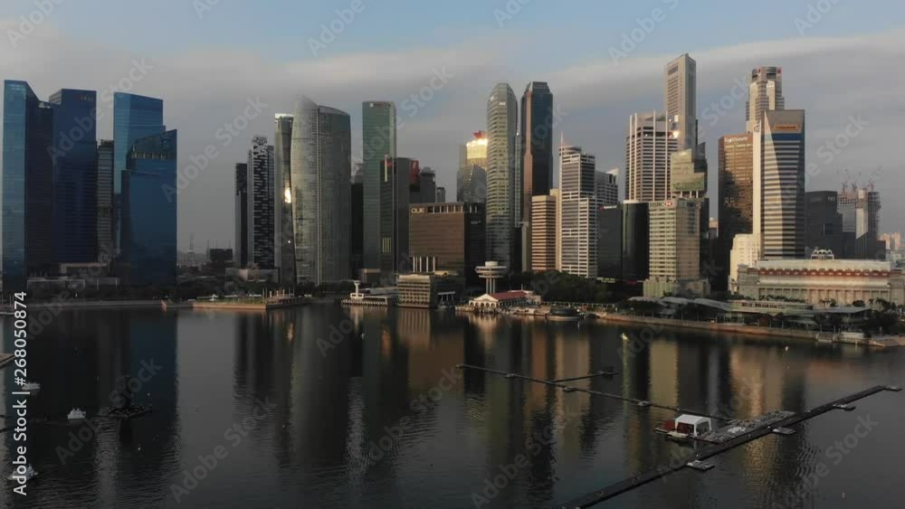 Aerial panoramic view of the financial district in Singapore with drone flying sideways from right to left Aerial panoramic view of the financial district in Singapore with drone flying sideways from right to left