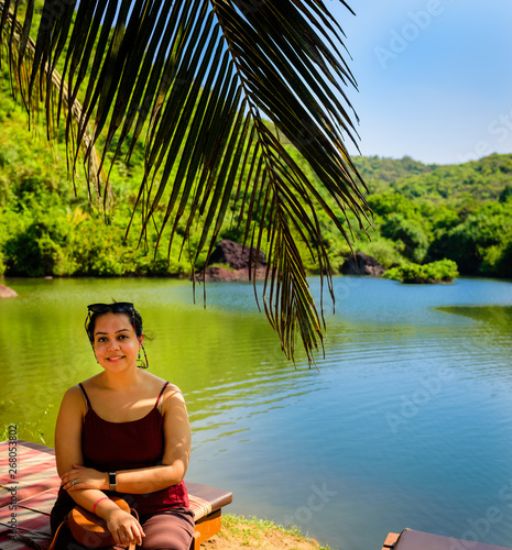 A girl enjoying nature's beauty at the sweet water lake near the ocean.