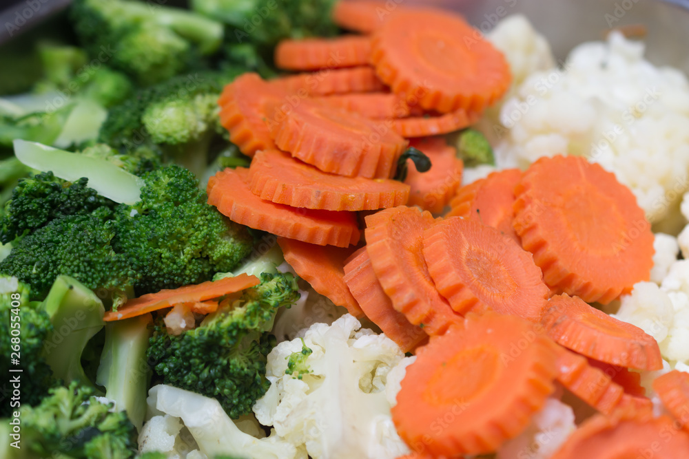 broccoli cauliflower and carrots on table broccoli cauliflower and carrots on table