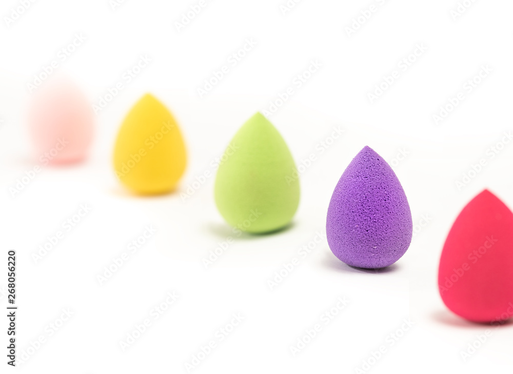 Cosmetic Foundation Sponge Applicator To Remove Excess Foundation on White Background. Egg Round Shape Foundation Sponge. Close Up. Selective Focus. Cosmetic Foundation Sponge Applicator To Remove Excess Foundation on White Background. Egg Round Shape Foundation Sponge. Close Up. Selective Focus.