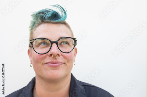 studio portrait of laughing queer woman