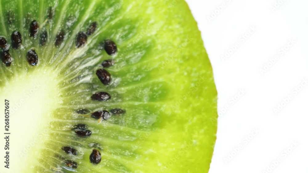 Macro shot of fresh green kiwi fruit rotating. 4k close up footage. Macro shot of fresh green kiwi fruit rotating. 4k close up footage.