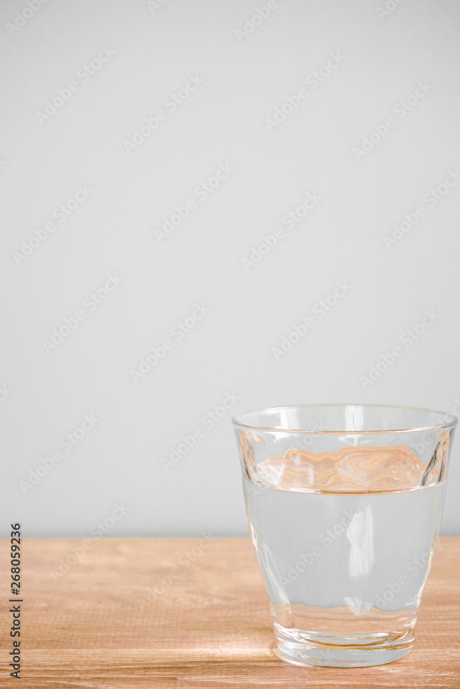 Glass of water on the table. テーブルの上のグラス一杯の水