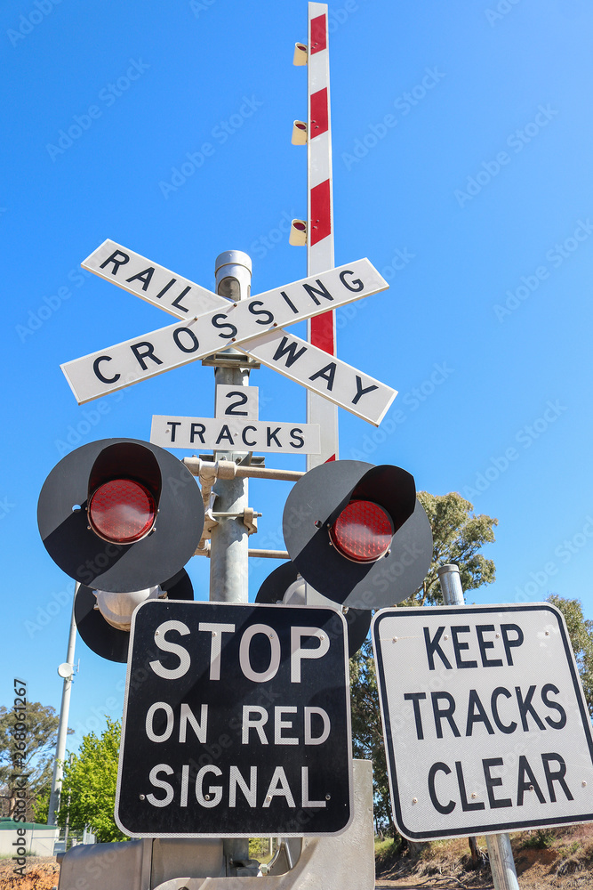 Black White And Red Railway Crossing Warning Signs Lights And Boom Gates In A Blue Sky Stock Photo Adobe Stock Black White And Red Railway Crossing Warning Signs Lights And Boom Gates In A Blue Sky Stock Photo Adobe Stock