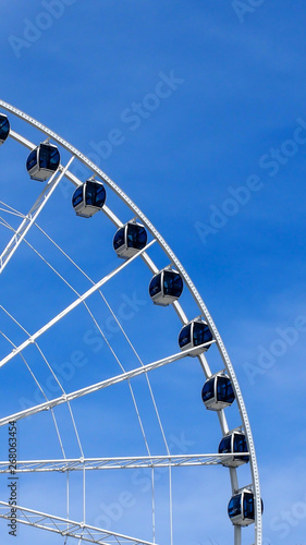 amusement park ferris wheel and blue sky