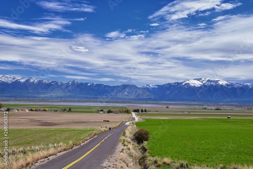 Tremonton and Logan Valley landscape views from Highway 30 pass, including Fielding, Beaverdam, Riverside and Collinston towns, by Utah State University, in Cache County along the Wasatch Front Range  photo